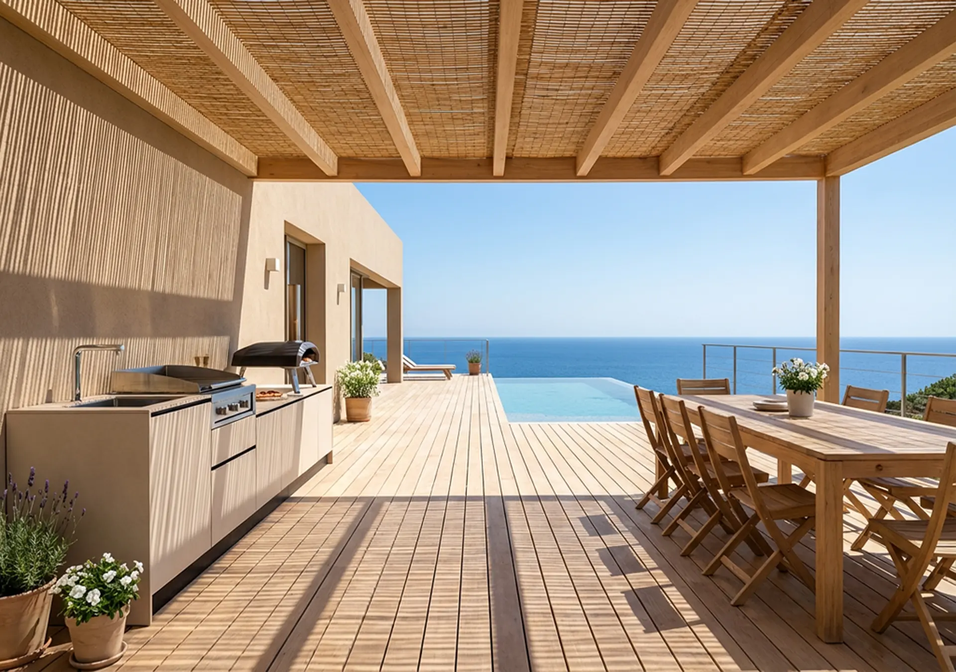 cuisine d'extérieur avec plancha à poser four à pizza terrasse table à manger extérieure chaises piscine vue mer méditéranée Marseille Bouches du Rhône
