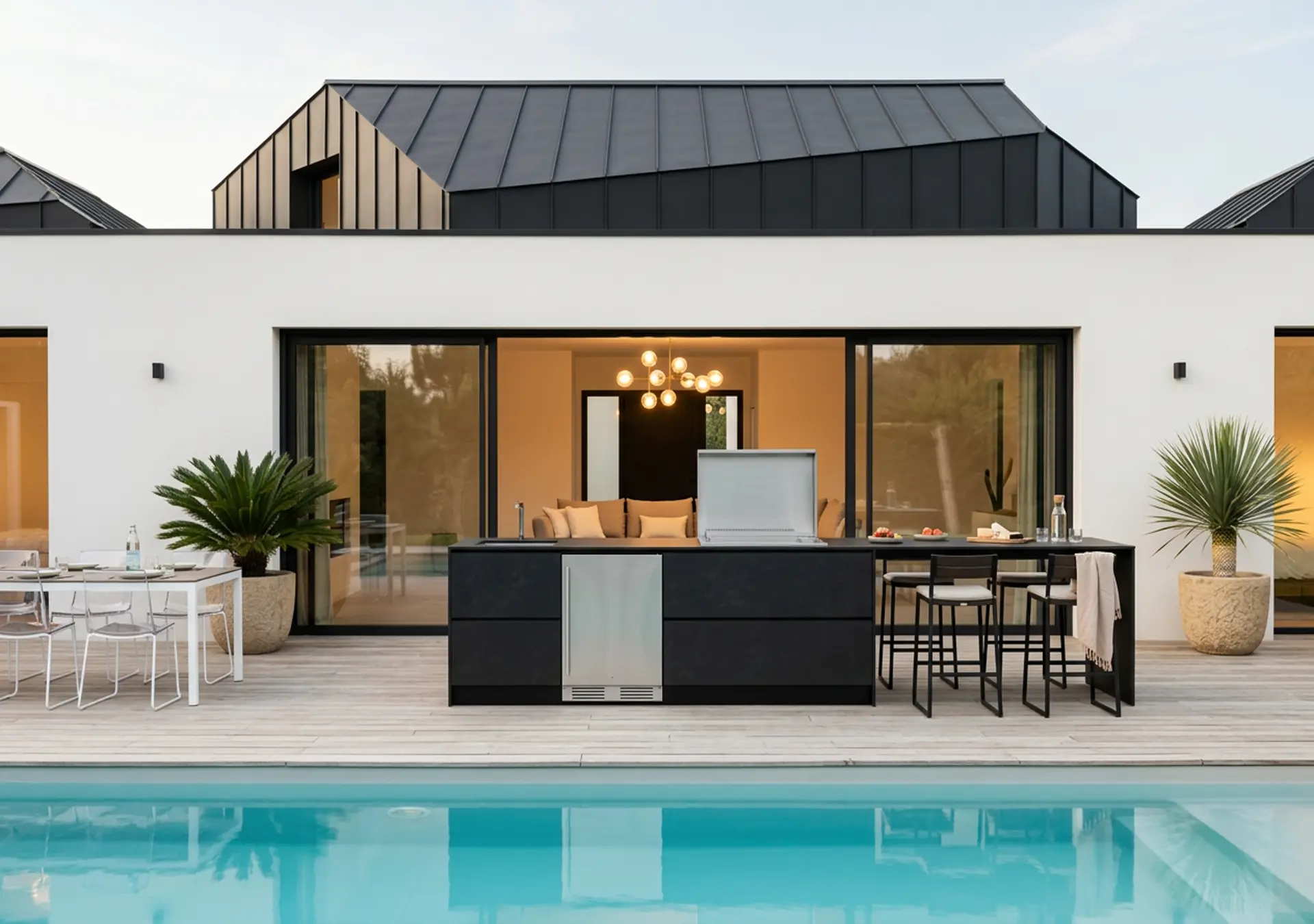 cuisine d'été cuisine d'extérieur avec plancha encastré réfrigérateur frigo extérieur comptoir bar chaise haute piscine Loire Atlantique